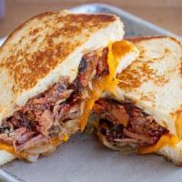 Burnt Ends Melt · Smokehouse Burnt Ends with provolone & cheddar cheese topped with caramelized onions on slic...
