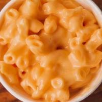 Mac And Cheese  · A creamy blend of four cheeses with a classic elbow noodle.