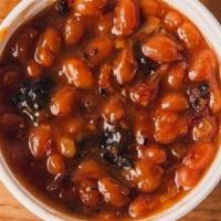 Baked Beans · Sweet and savory baked beans slow cooked with brown sugar, chopped onions, pulled pork, bris...