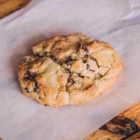 Reese'S Cookie · Peanut butter cookie filled with mini Reese's cups and chocolate chips.