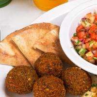 Mediterranean Breakfast Platter · Two eggs any style, four falafels, 2 Oz of hummus, and house salad