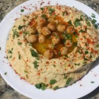 Old-Fashioned Hummus · Mediterranean Hummus Topped with Chickpeas, Spices & Extra Virgin Olive Oil, Served with Pit...