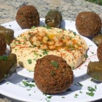Mediterranean Sampler · Hummus, Falafel, Israeli Salad Served with Pita.