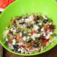 Greek Salad · Lettuce, Tomatoes, Cucumbers, Mixed Peppers, Red Onions, Parsley, Black Olives, Feta Cheese.