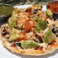 Italian Melt · Pesto & Sun-Dried Tomato Spread, Chicken, Onions, Black Olives, Tomatoes  Topped with Mozzar...