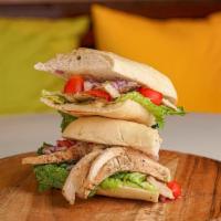 Pesto Chicken Panini · Chicken, Tomatoes, Onions, & Pesto Spread