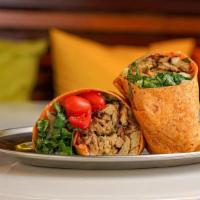 Vegan Chicken Wrap · Vegan Chicken Mixed with Onions & Peppers, Lettuce, Tomatoes, Carrots, Cucumbers.. Served wi...