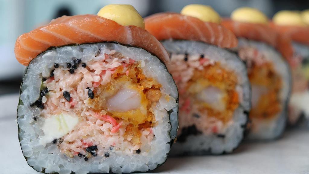 Samurai Roll · Krab salad, cream cheese, shrimp tempura, avocado, salmon on top, tobiko, yellow pepper aioli, and eel sauce.