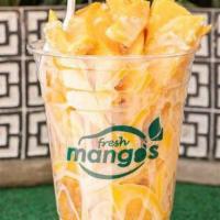 Sweet Temptation Mango · Mango slices, sweetened condensed milk, coconut flakes, cinnamon.