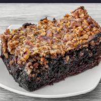 Pecan Pie Brownie · Our old fashioned brownies topped with a layer of pecan pie. Sure to quench your chocolate l...