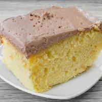 Yellow Cake W/ Chocolate Icing · Our buttery golden yellow cake topped with a rich chocolate icing.
