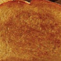 Texas Toast, 1 Piece · Lightly covered in garlic butter and toasted golden brown.