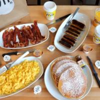 Family Brunch For Four · 8 scrambled eggs, 4 pancakes, 4 slices of French toast, 8 strips of bacon, 8 sausage links, ...