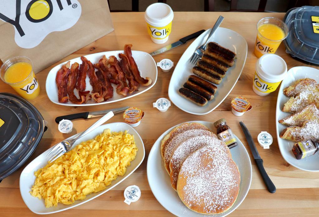 Family Brunch For Four · 8 scrambled eggs, 4 pancakes, 4 slices of French toast, 8 strips of bacon, 8 sausage links, 2 cups of Yolk blend coffee, 2 cups of OJ. Comes with syrup and butter. 

No Substitutions please.
