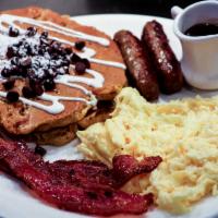 Yolk All-Star Combo · Two eggs any style, two sausage links, two slice of bacon and your choice of two pancakes, t...