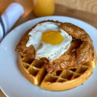 Chicken ‘N’ Waffles · Staff faves. Bacon waffle topped with crispy fried boneless chicken breast, sausage gravy, a...