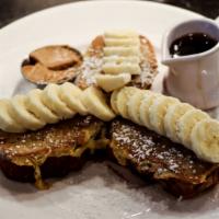 Banana Nut Bread French Toast · Thick cut slices of banana bread, dipped in our secret batter and grilled. Topped with slice...