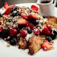 Nutella Crepes · Stuffed with Nutella, topped with bananas, strawberries, chopped walnuts, chocolate sauce, w...