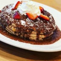 Pancakes · All dusted with powdered sugar. Sides of whipped butter and warm syrup.