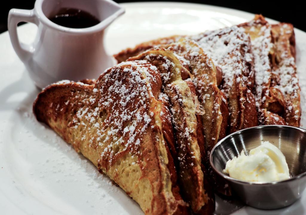 French Toast · All dusted with powdered sugar. Sides of whipped butter and warm syrup.