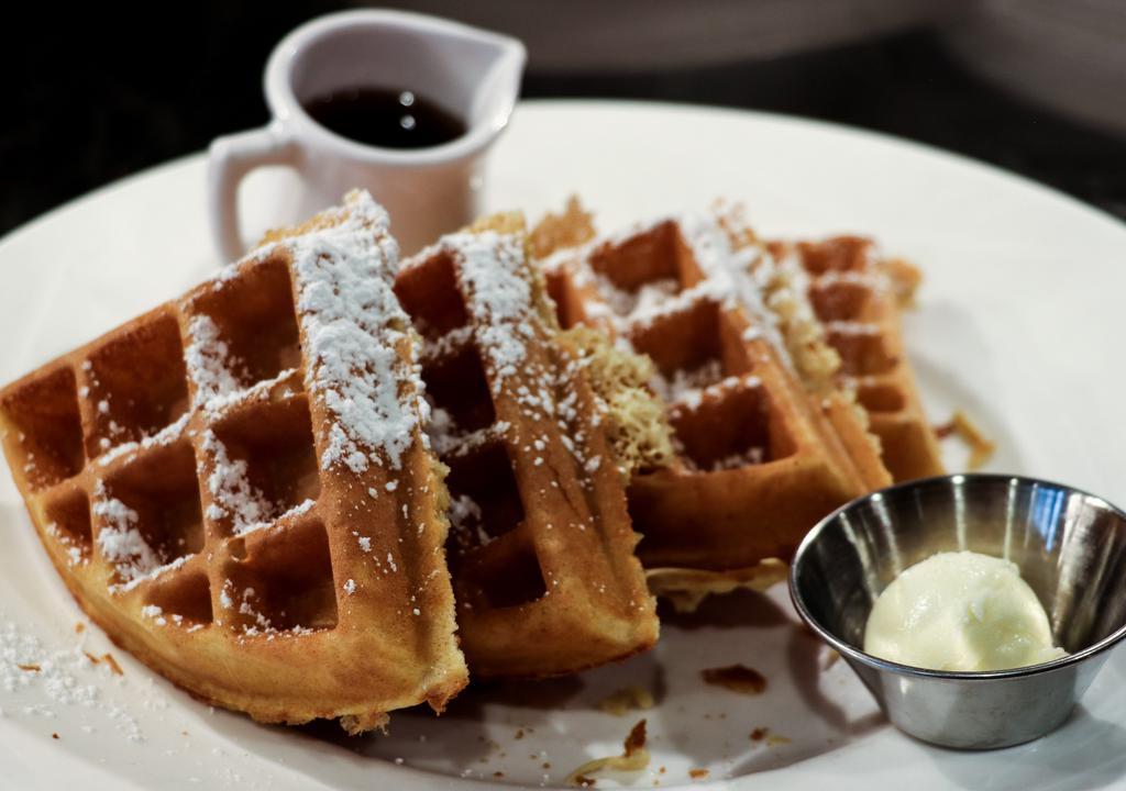 Waffles · All dusted with powdered sugar. Sides of whipped butter and warm syrup.
