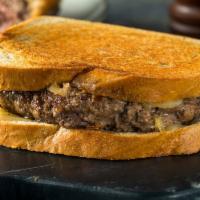 Patty Melt · Served on marble rye bread with sautéed onions, Swiss and American cheese.