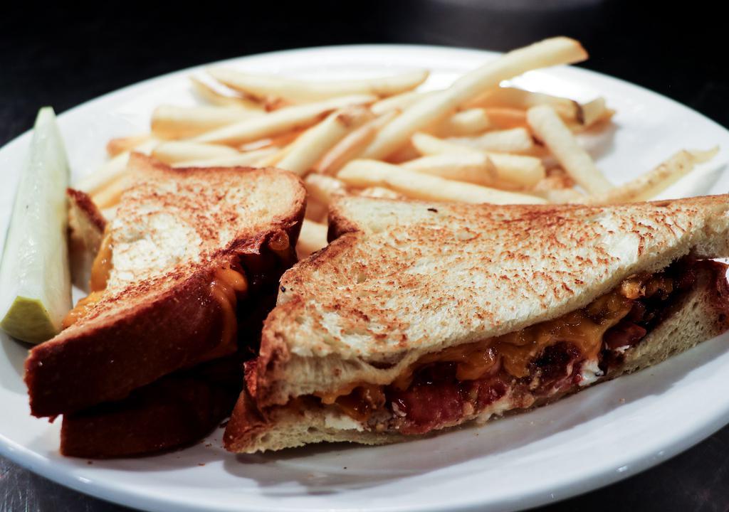 Grilled Cheese Supreme · Grilled tomato, bacon, melted goat and cheddar cheese on grilled challah bread.