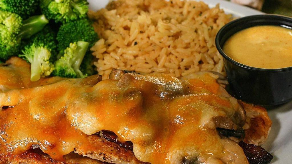 Grilled Chicken Dinner · 2 seasoned chicken breasts grilled or blackened and served with seasoned rice, steamed broccoli and your choice of honey mustard or BBQ sauce. Try it Nashville Hot style (770-980 Cal)