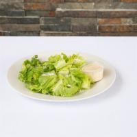 Caesar Salad · Romaine lettuce, croutons with spiced parmesan cheese on top. Choice of dressing.