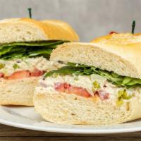 Tuna Salad Sandwich · Albacore tuna, red onion, celery and peas served on baguette spread with a fig orange jam wi...