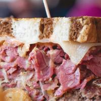Yankee Reuben · Corned beef, Swiss cheese, caraway sauerkraut and thousand island dressing served on griddle...