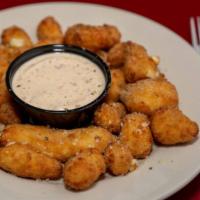 Cheese-Balls O’ Glory™ · These battered, deep-fried dollops of cheese curd and jalapeño bits might be the tastiest ba...