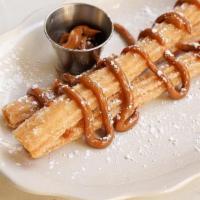 Papi Churros · 3 large churros served with Nutella or dulce de leche.