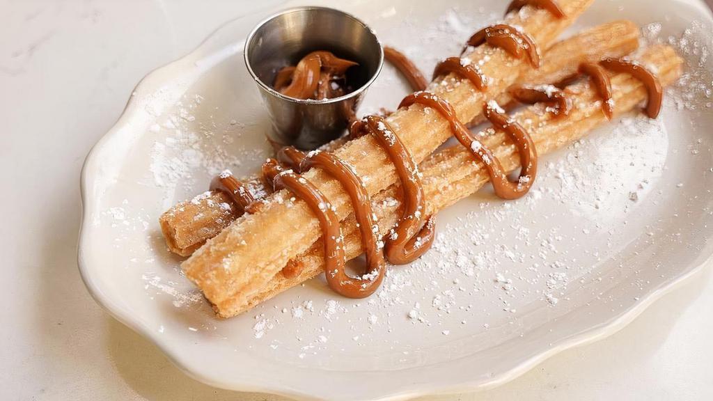 Papi Churros · 3 large churros served with Nutella or dulce de leche.