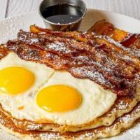 Bacon & Eggs Pancake · 2 large pancakes, a loooot of bacon, two sunny side up eggs, maple syrup on side