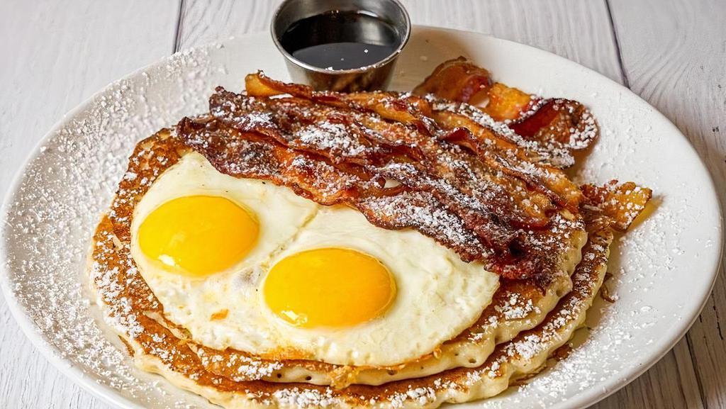 Bacon & Eggs Pancake · 2 large pancakes, a loooot of bacon, two sunny side up eggs, maple syrup on side