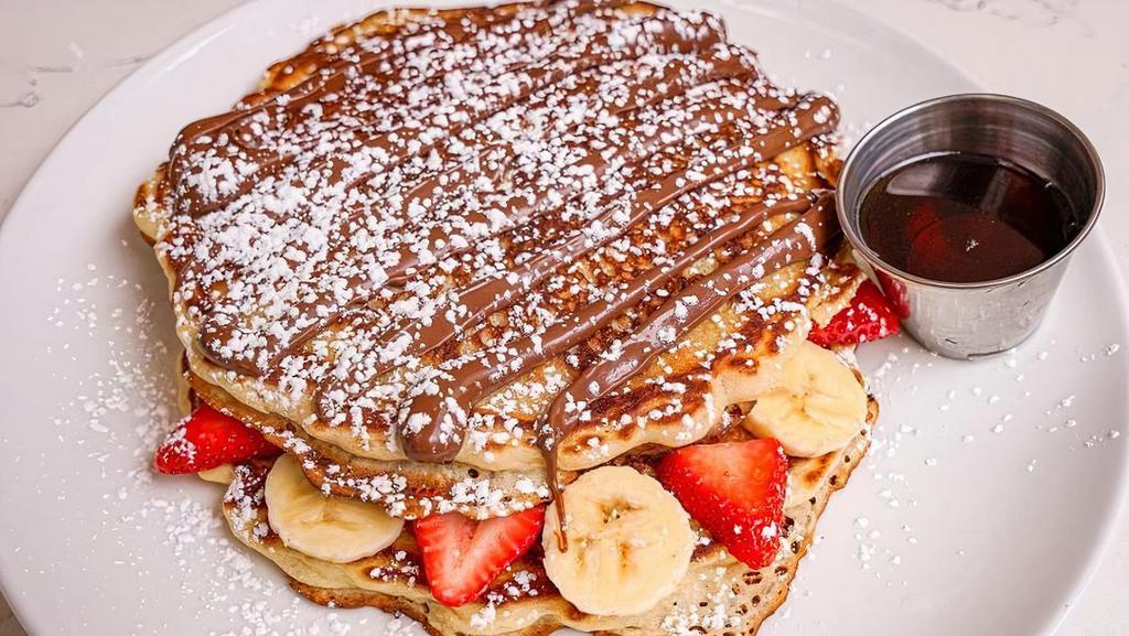 Pancake Express · 2 large pancakes, Nutella, strawberries, banana, maple syrup on the side.
