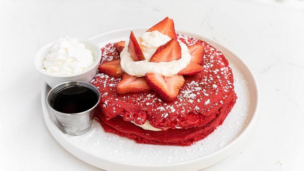 Red Velvet Pancake · 2 large red velvet pancakes, cream cheese glazed, strawberries, whipped cream, maple syrup on the side.