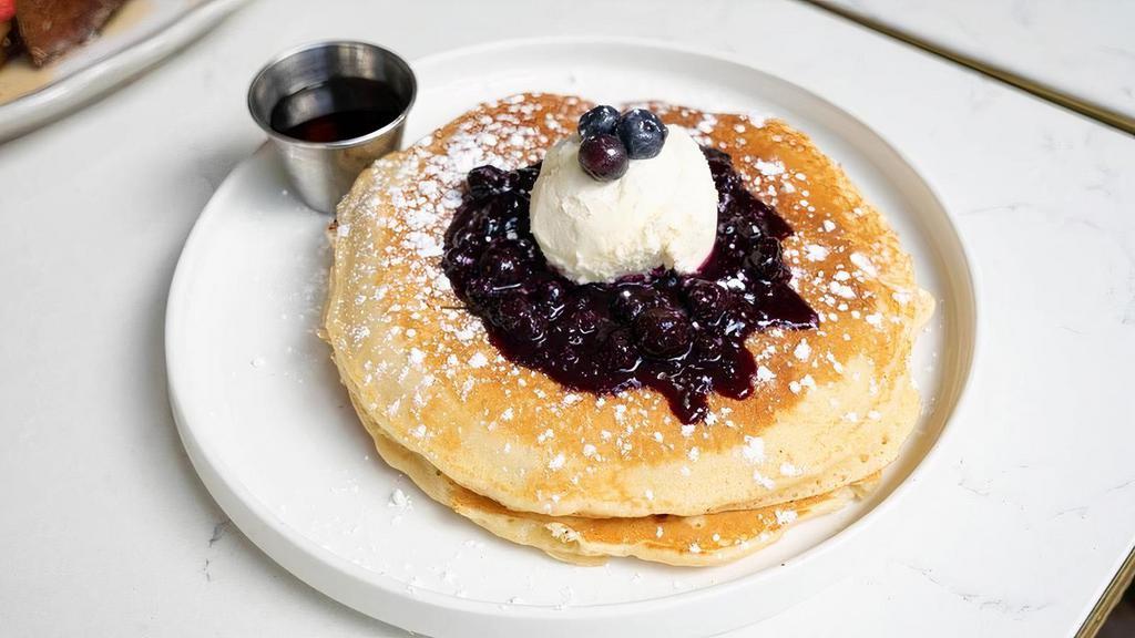 Blueberry Pancake · 2 large blueberry pancakes, blueberry compte with lemon zests, fresh mascarpone, maple syrup on side.