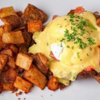 Smoked Salmon & Avocado Benedict · open faced croissant topped with smoked salmon, avocado, 2 poached eggs and hollandaise sauc...