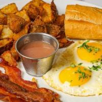 2 Eggs Any Style · 2 eggs your style, your choice of protein. Served with breakfast potatoes, mini French crois...