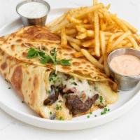 French Cowboy Crepe · stuffed with diced beef filet, sautéed onions and peppers, Monterey Jack, served with French...