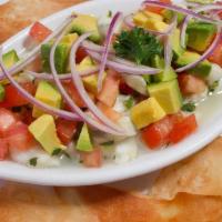 Ceviche Tropical · Fresh Fish Cured in Lime, Cilantro and Jalapenos, Prepared with Diced Avocado, Tomatoes and ...