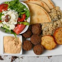 Falafel Platter (5 Pcs). · Served with Spinach rice and Rosemary Red Potatoes.