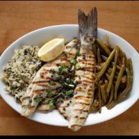 Bronzini · Mediterranean Sea Bass imported from the Greek islands. Served with spinach rice and green b...
