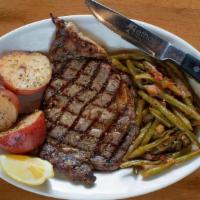Prime Ribeye Steak  12 Oz. · Grilled to perfection, served with Lemon Potatoes and Green Beans.