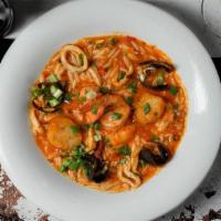 Orzo Paella · orzo pasta with shrimp, calamari, scallops, mussels in a zesty tomato sauce.
