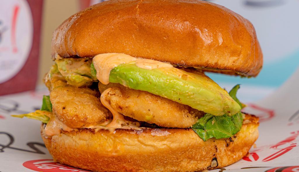 Crispy Chicken Sandwich · breaded chicken breast golden fried with avocado, lettuce tomato  and spicy mayo