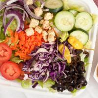Greek Salad · Garden salad topped with Feta cheese, Greek olives and pepperoncini. The large salad comes w...