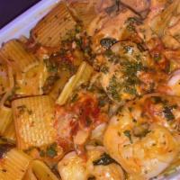 Rigatoni Ala Vodka · Sun-dried tomatoes, pancetta sauteed, a touch of marinara, cream and a blend of grated chees...